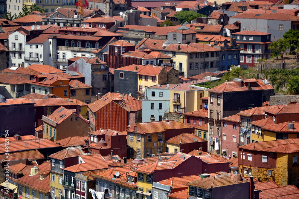 Porto, Portugal - August 20, 2015: Cityscape of Porto in summer, with a good weather. General view of the roofs of Porto, most likely made of clay tiles.