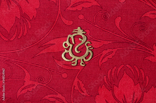 lord ganesha symbol or icon on a colorful wedding card