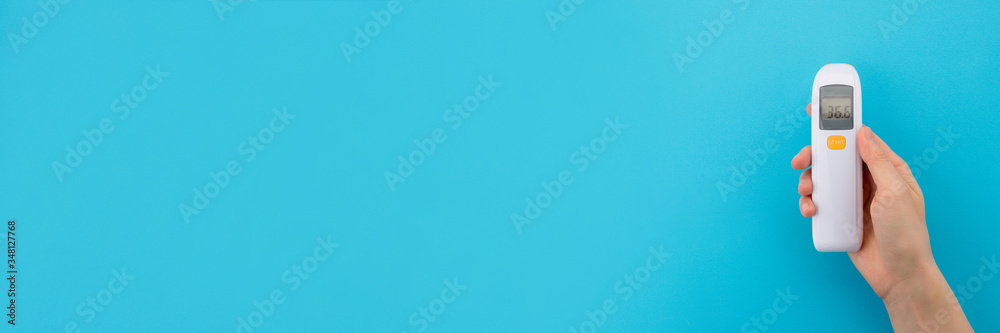 Infrared non-contact thermometer for temperature measurement. Concept of an electronic device to check Your health Infrared non-contact thermometer for temperature measurement. Concept of an electronic device to check Your health