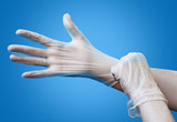 Female hands in antiseptic gloves