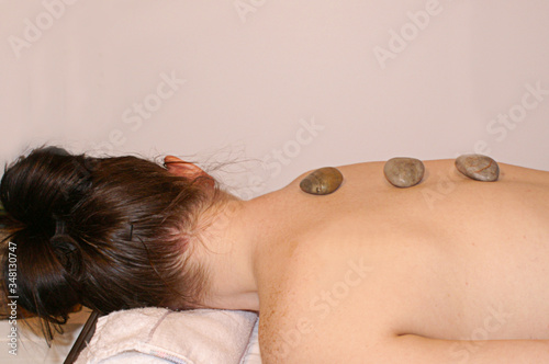 Woman in Spa With Stones on Back