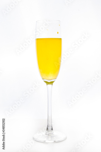 colored water in a glass on a white background. bright colors contrast
