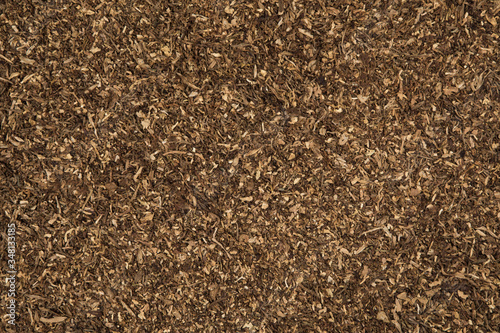 A pile of freshly cut tobacco texture in the background