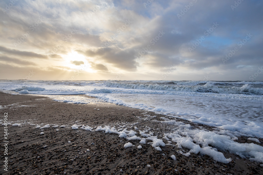 beach at sunset with sea foam beach at sunset with sea foam