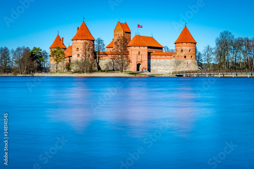 Trakai castle: medieval gothic Island castle, located in Galve lake. One of the most popular tourist destination in Lithuania. Long exposure. Copy space.