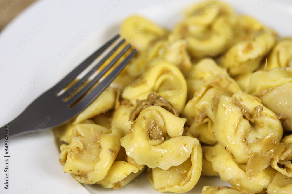 plate of tortellini on a table