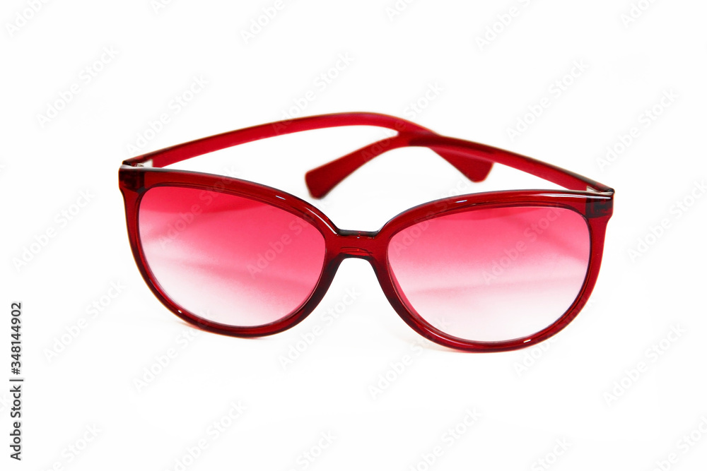 Fototapeta premium women's red sunglasses on a white background