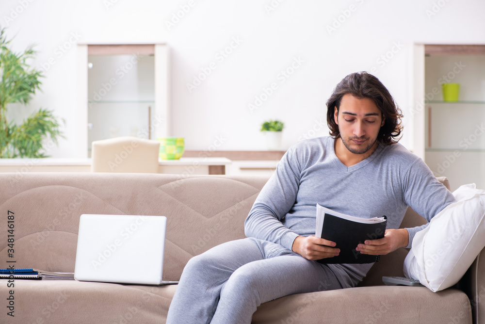 Young male employee freelancer working from home Young male employee freelancer working from home