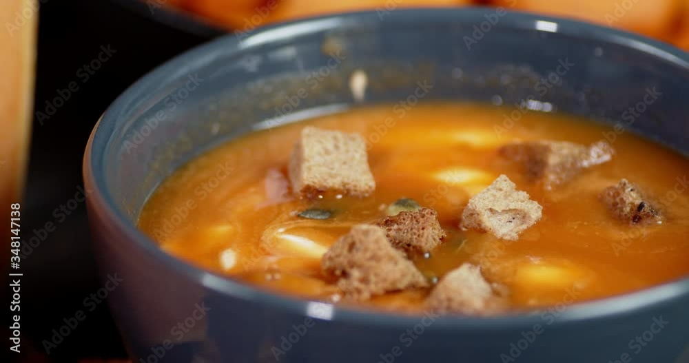 In a bowl with pumpkin soup fall grain crackers. In a bowl with pumpkin soup fall grain crackers.