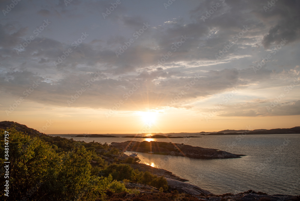 Sunset on Marstrand with two boats laying in the bay