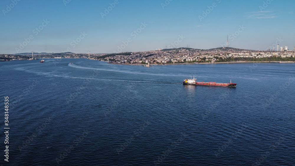 Bosphorus Bridge and cargo ship in Istanbul Turkey