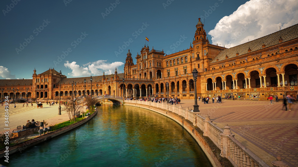 Seville, Spain - February 18th, 2020 - the Plaza de Espana / Spain Square with the Canal, Tourists visiting and Architecture Details, in Seville City.