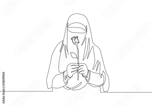 One single line drawing of young attractive Asian muslimah wearing burqa and holding rose flower. Traditional beauty Arabian woman niqab cloth concept continuous line draw design vector illustration