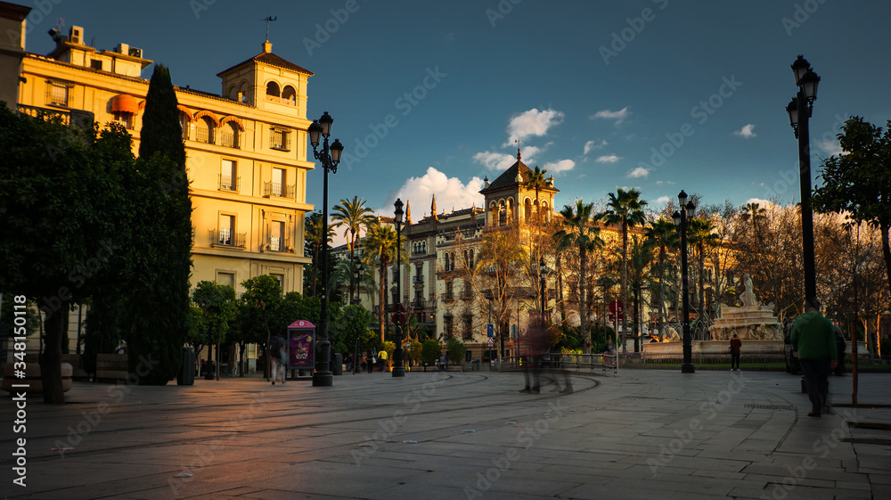 Naklejka premium Seville, Spain - February 20th, 2020 - Fountain of Hispalis / Roman Seville and the Alfonso XIII Hotel in Puerta de Jerez in Seville City, Spain.