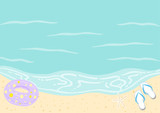 浮き輪とビーチサンダルのあるビーチ　海と砂浜