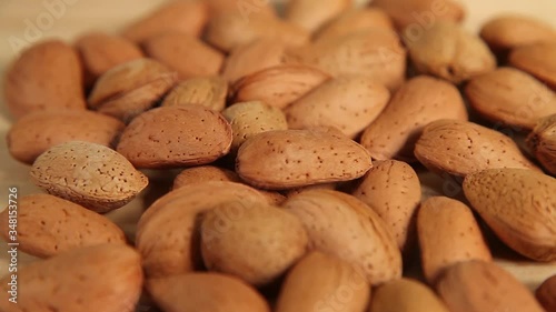  almonds  rotating on wooden background