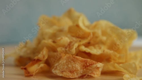 Chips potatoes on light blue background