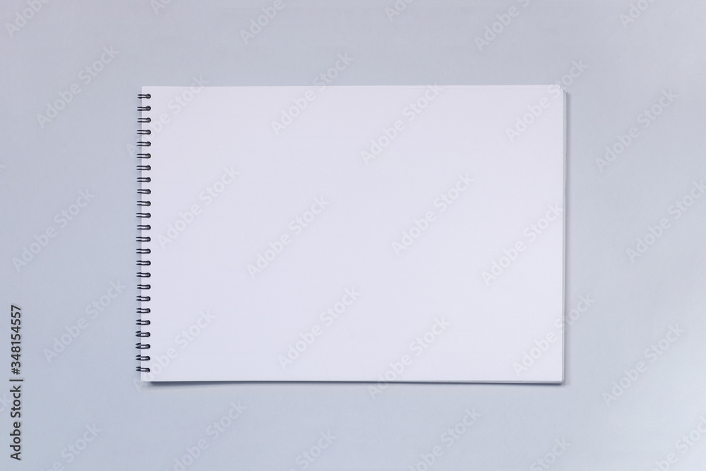 White Spiral Album or sketchbook mock up on light table White Spiral Album or sketchbook mock up on light table