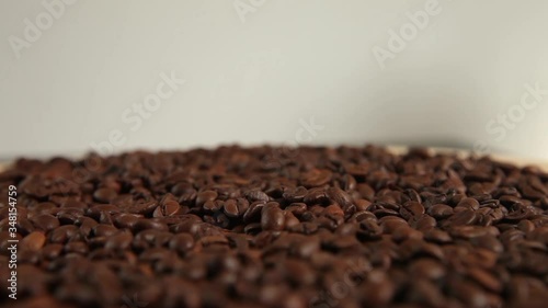 coffee beans rotating on light background