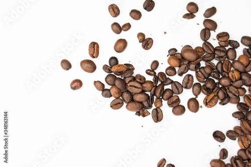Coffee beans on white background. Top view. Shallow depth of field.