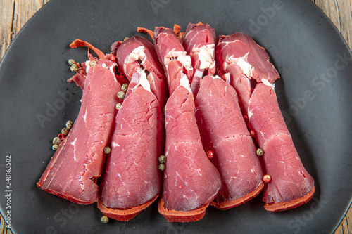 Turkish Pastrami slices on plate - Kayseri pastirma photo