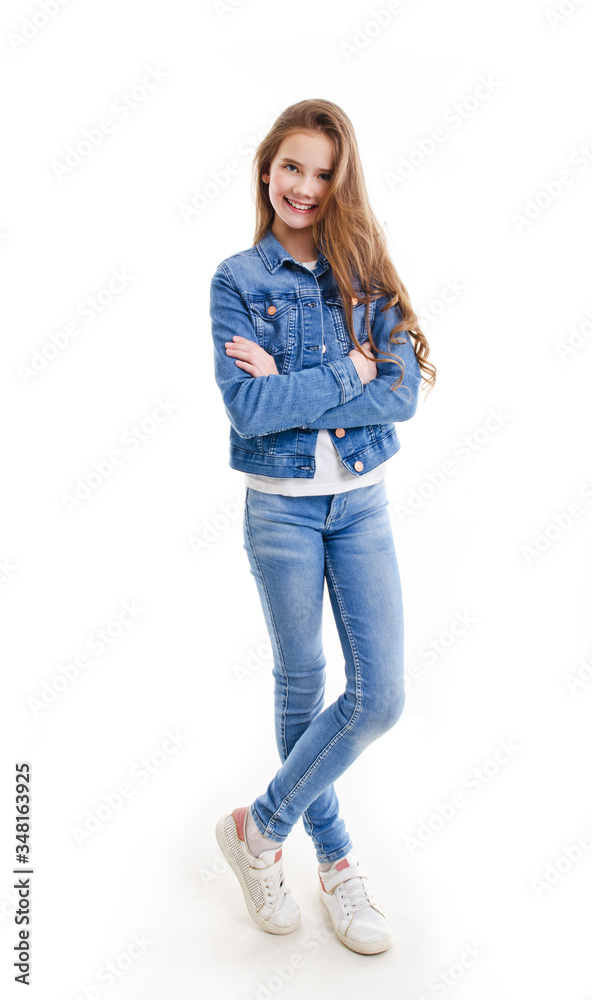 Portrait of adorable smiling little girl child preteen standing isolated Portrait of adorable smiling little girl child preteen standing isolated