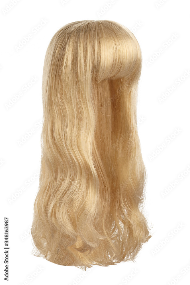 Naklejka premium Subject shot of a natural looking golden blonde wig with bangs and wavy strands. The long wig is isolated on the white background.