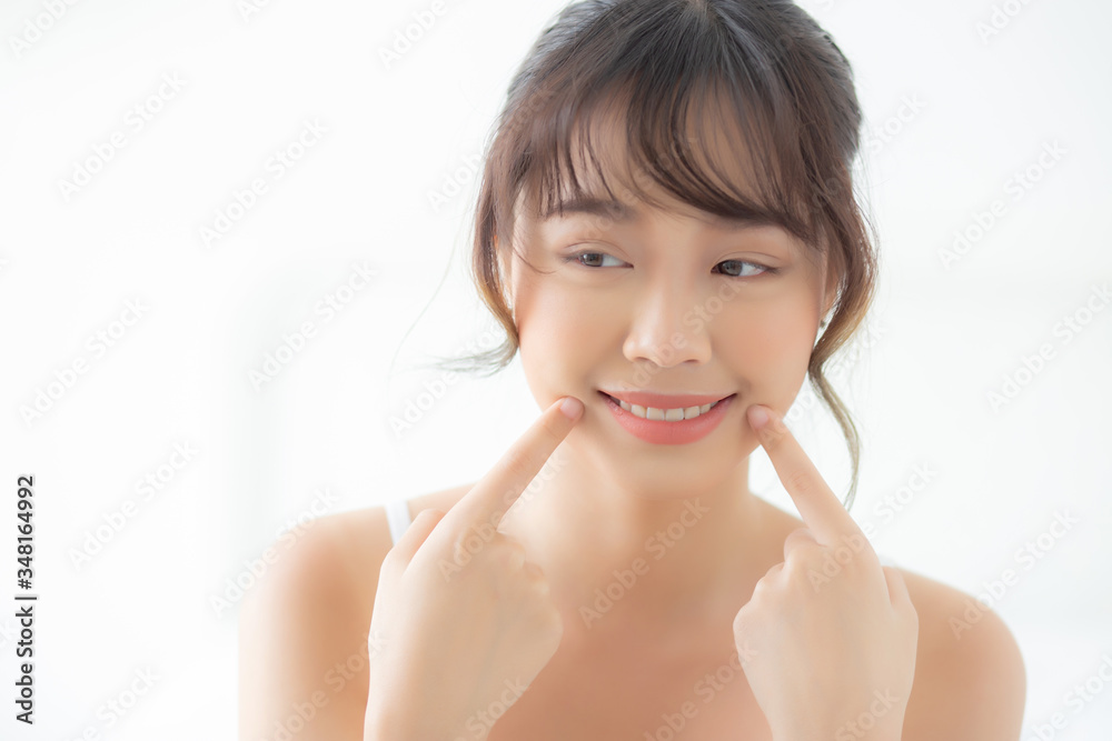 Beautiful portrait young asian woman smiling healthy and wellness at bedroom, beauty asia girl skin care touch teeth makeup and cosmetic with happy with fresh, lifestyle and relax concept. Beautiful portrait young asian woman smiling healthy and wellness at bedroom, beauty asia girl skin care touch teeth makeup and cosmetic with happy with fresh, lifestyle and relax concept.