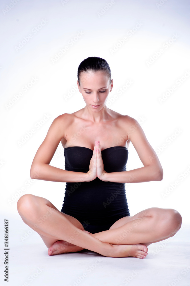 Portrait of smiling young pregnant fitness model in sportswear, studio shot Portrait of smiling young pregnant fitness model in sportswear, studio shot
