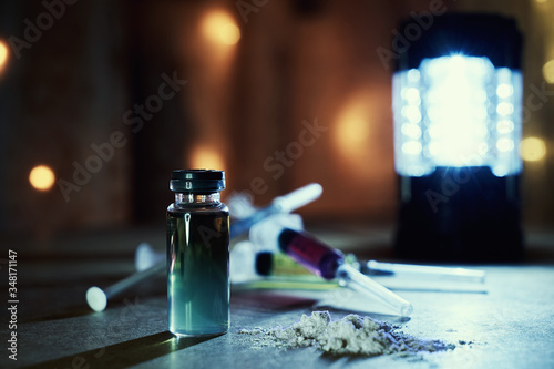 Фотография Bottle of heroin and narcotic syringes