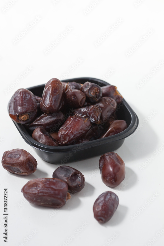 Dried dates fruits on white background, tasted sweet and chewy Dried dates fruits on white background, tasted sweet and chewy