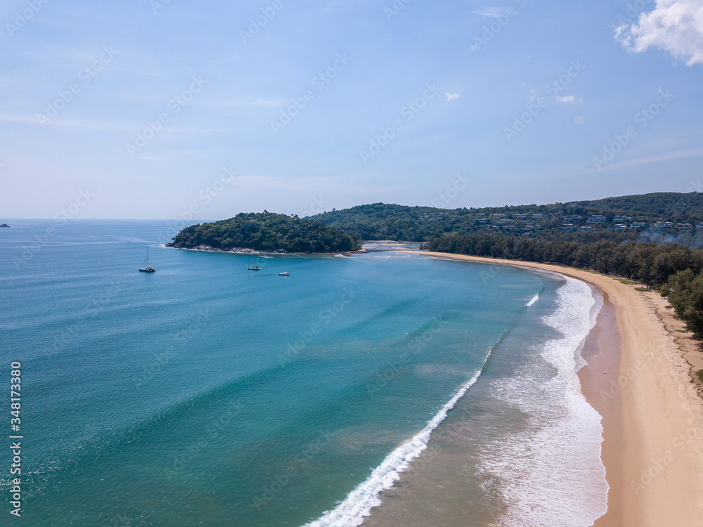 The tranquil sandy beach stretches west of Phuket.