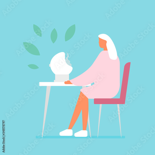 Woman uses a steam inhaler. Flu treatments, facial skin care. Herb aromatherapy