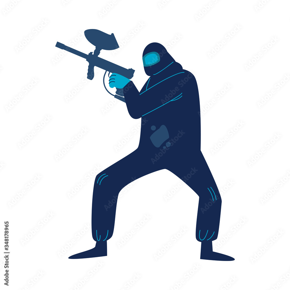 Man in special protective costume and mask playing paintball with shooting weapon