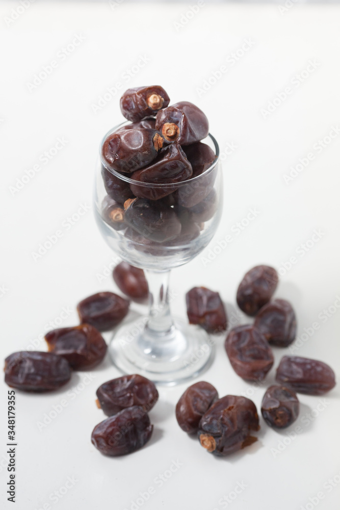 Dried dates fruits on white background, tasted sweet and chewy Dried dates fruits on white background, tasted sweet and chewy