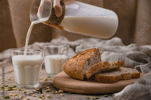 Rustic breakfast with milk and bread. World Milk Day on the first of June. Horizontal shot.