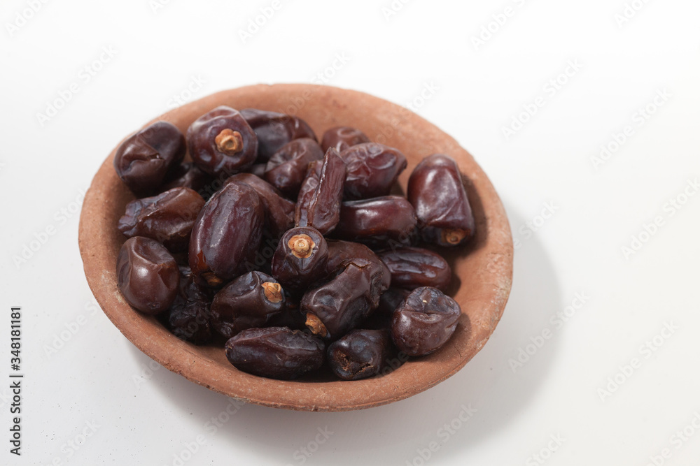 Dried dates fruits on white background, tasted sweet and chewy Dried dates fruits on white background, tasted sweet and chewy