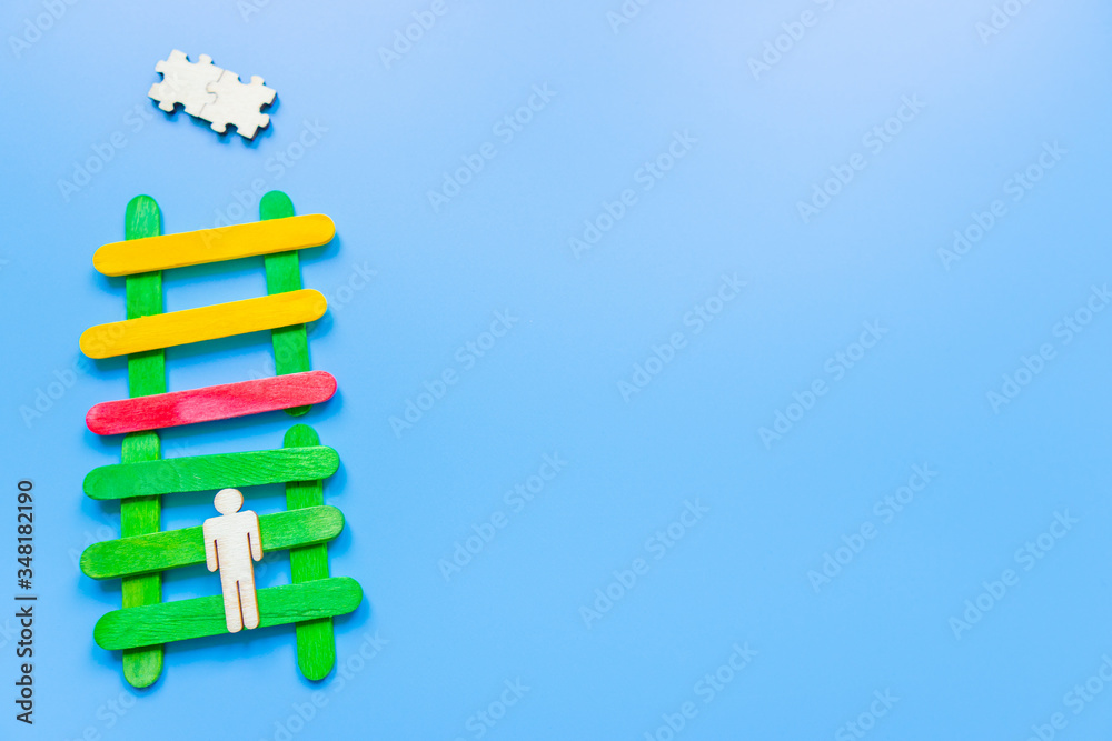 Business image of wooden ladder with people icons over blue table, human resources and management concept