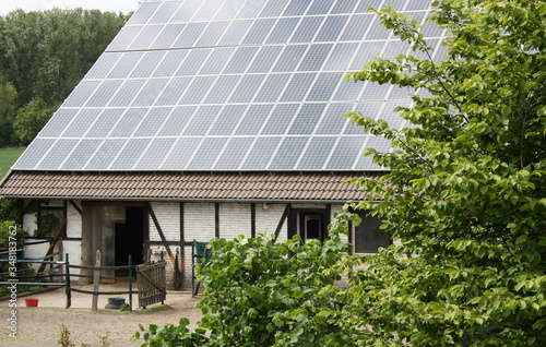 Photovoltaikanlage auf einem Pferdestall bei Sonnenlicht in Lippetal Büninghausen, Nordrhein-Westfalen, Germany photo