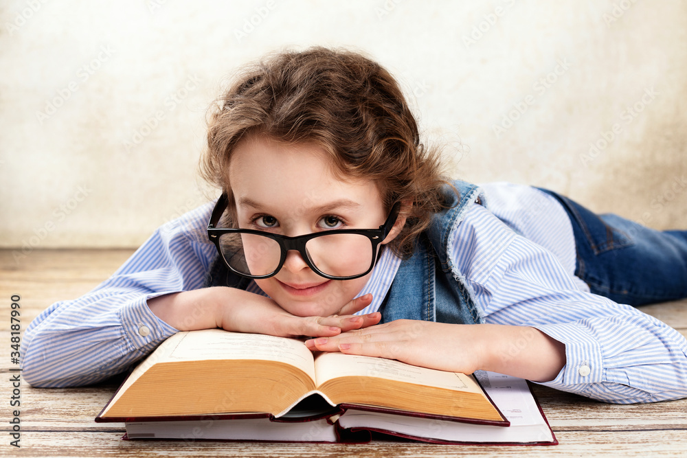 Young pretty girl studying and reading books at home Young pretty girl studying and reading books at home