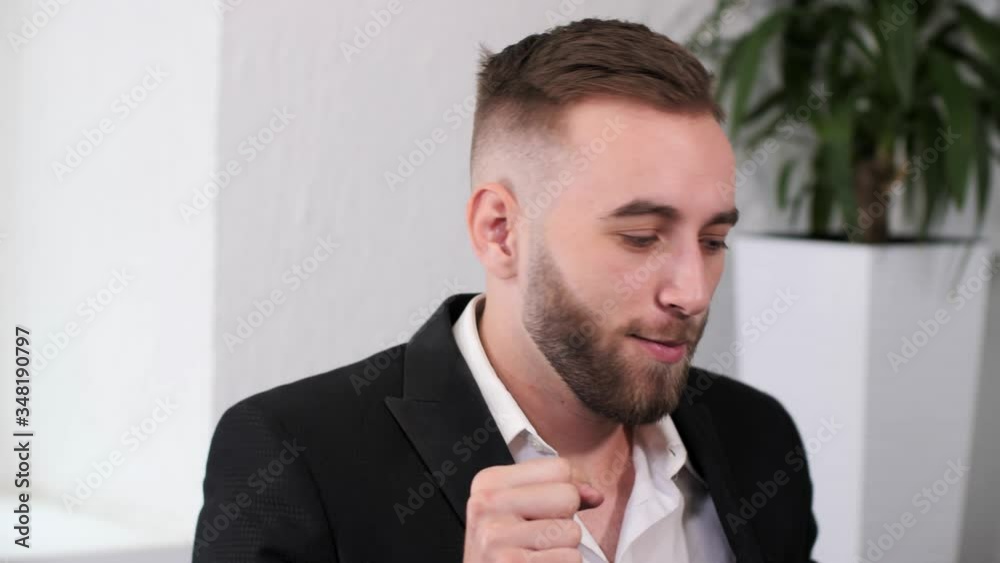 Young handsome office worker dancing in the workplace.Joyful businessman dancing in the office. Young handsome office worker dancing in the workplace.Joyful businessman dancing in the office.