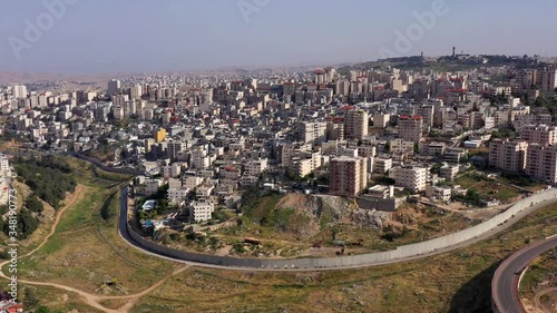 Israel and Palestine Divided By security Wall Aerial View
Drone Footage over Shuafat Refugee Camp And Jewsih Pisgat zeev neighborhood
 photo