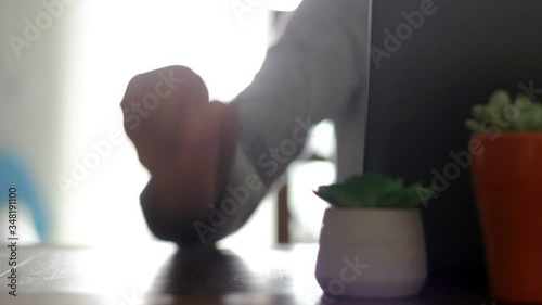 Angry woman beats fist on the table