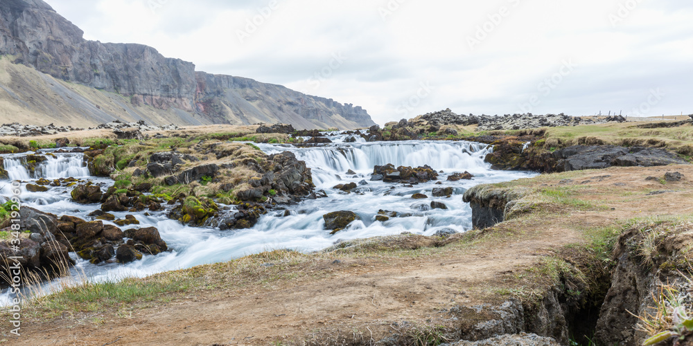 Large waterfall in Iceland surrounded by lava fields
