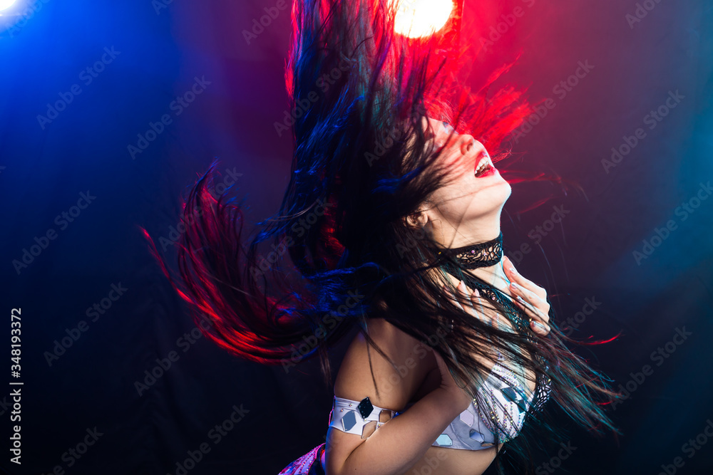 Fototapeta premium Portrait of a woman in oriental costume performing belly dance. Tribal fusion dance concept.