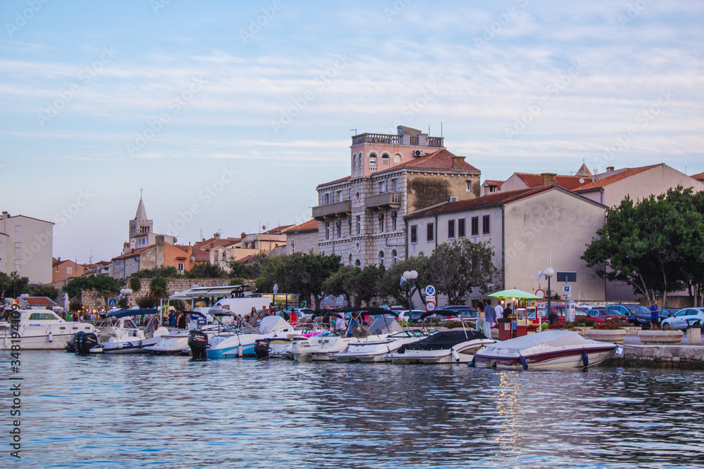 Picturesque coastal view of Rab town harbour bay. Rab island in Croatia is a popular tourist spot in summer.