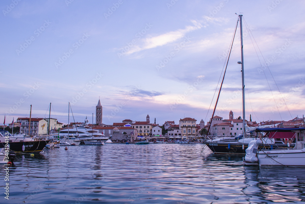 Picturesque coastal view of Rab town harbour bay. Rab island in Croatia is a popular tourist spot in summer.