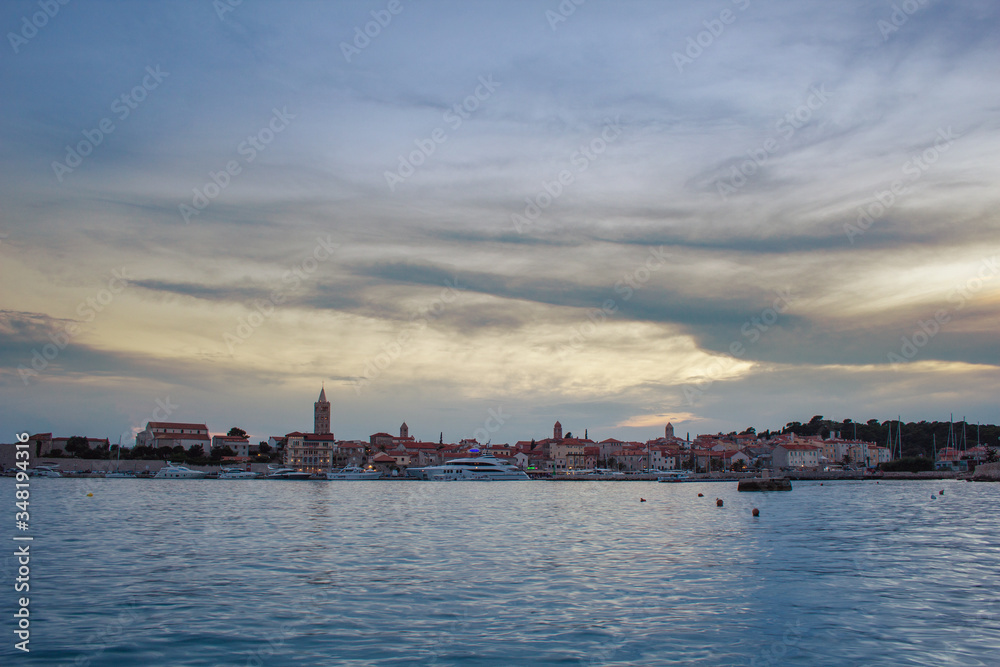 Picturesque coastal view of Rab town waterfront at night. Rab island, Croatia