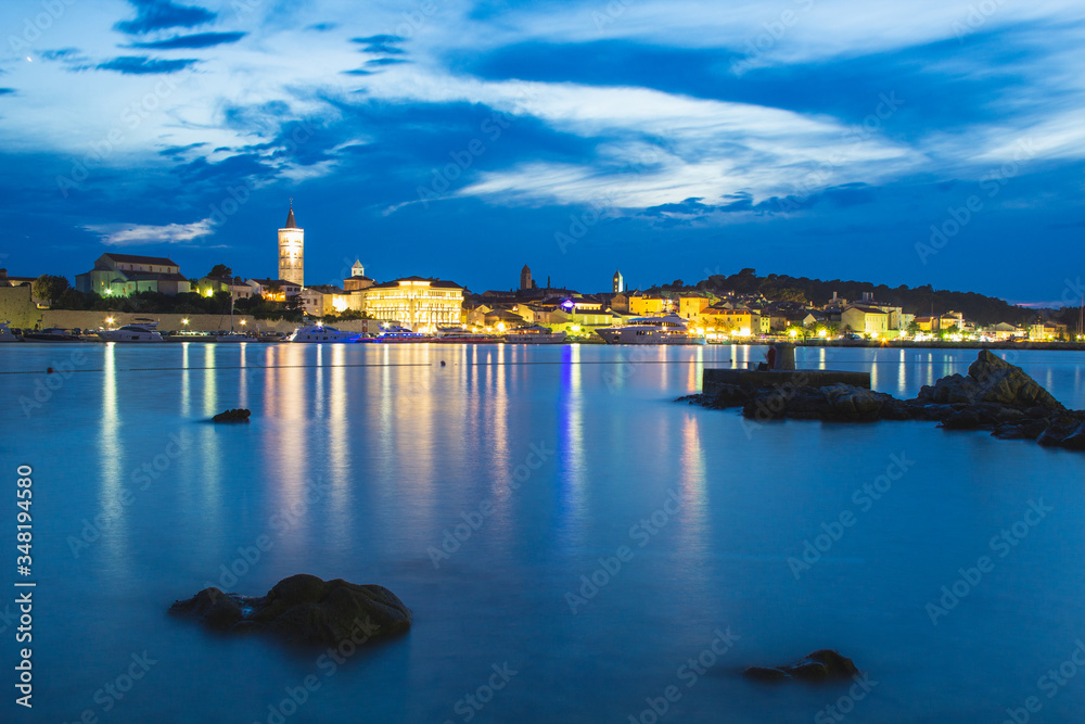 Picturesque coastal view of Rab town waterfront at night. Rab island, Croatia