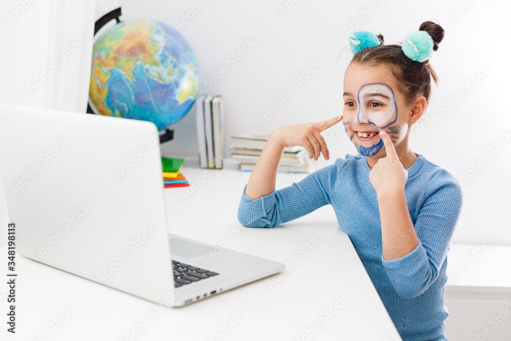 little girl studying theater on laptop online little girl studying theater on laptop online